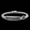 Bracciale a grumetta Zancan con targa e pietra nera.