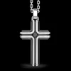 Collana Zancan in argento con pendente a croce e pietra nera.