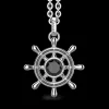 Collana Zancan in argento con pendente a timone e pietra nera.