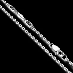 Collana Zancan in argento con pendente a croce e pietre nere.