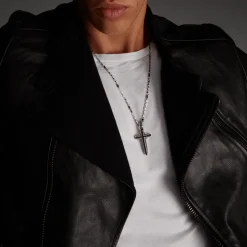 Collana Zancan in argento con pendente a croce e pietre nere.