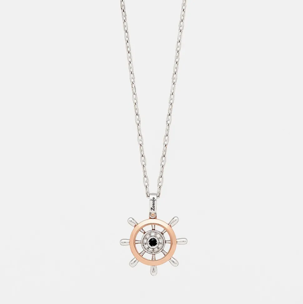 Collana zancan in oro con pendente timone e diamanti.